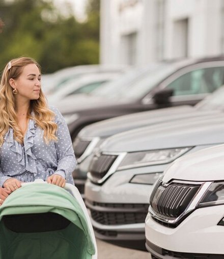 a girl watching cars